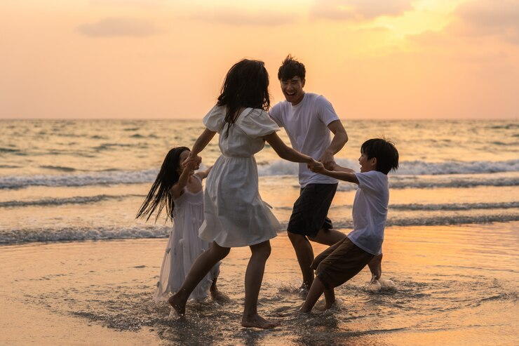 asian-young-happy-family-enjoy-vacation-beach-evening-dad-mom-kid-relax-playing-together-near-sea-when-silhouette-sunset-lifestyle-travel-holiday-vacation-summer-concept_7861-244